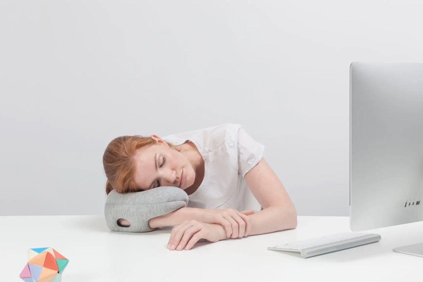 Woman using the Mini Desk & Travel Pillow in the office