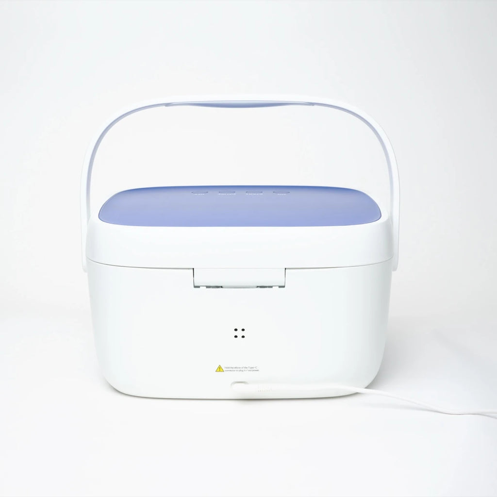 Liviliti Paptizer 360 CPAP sanitizer with its lid raised and power cord attached