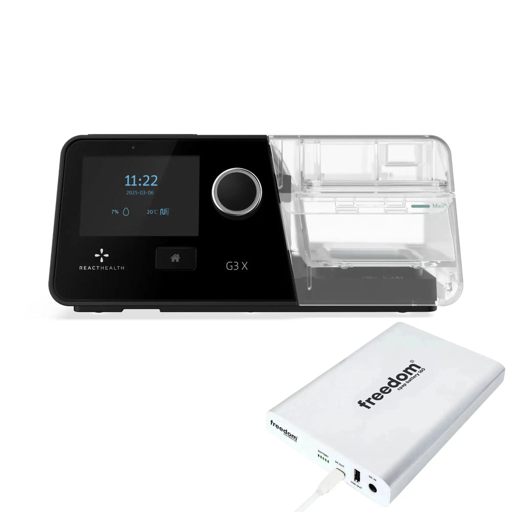 React Health G3 X Auto-CPAP machine angled beside white Freedom 160 backup battery with charging cable