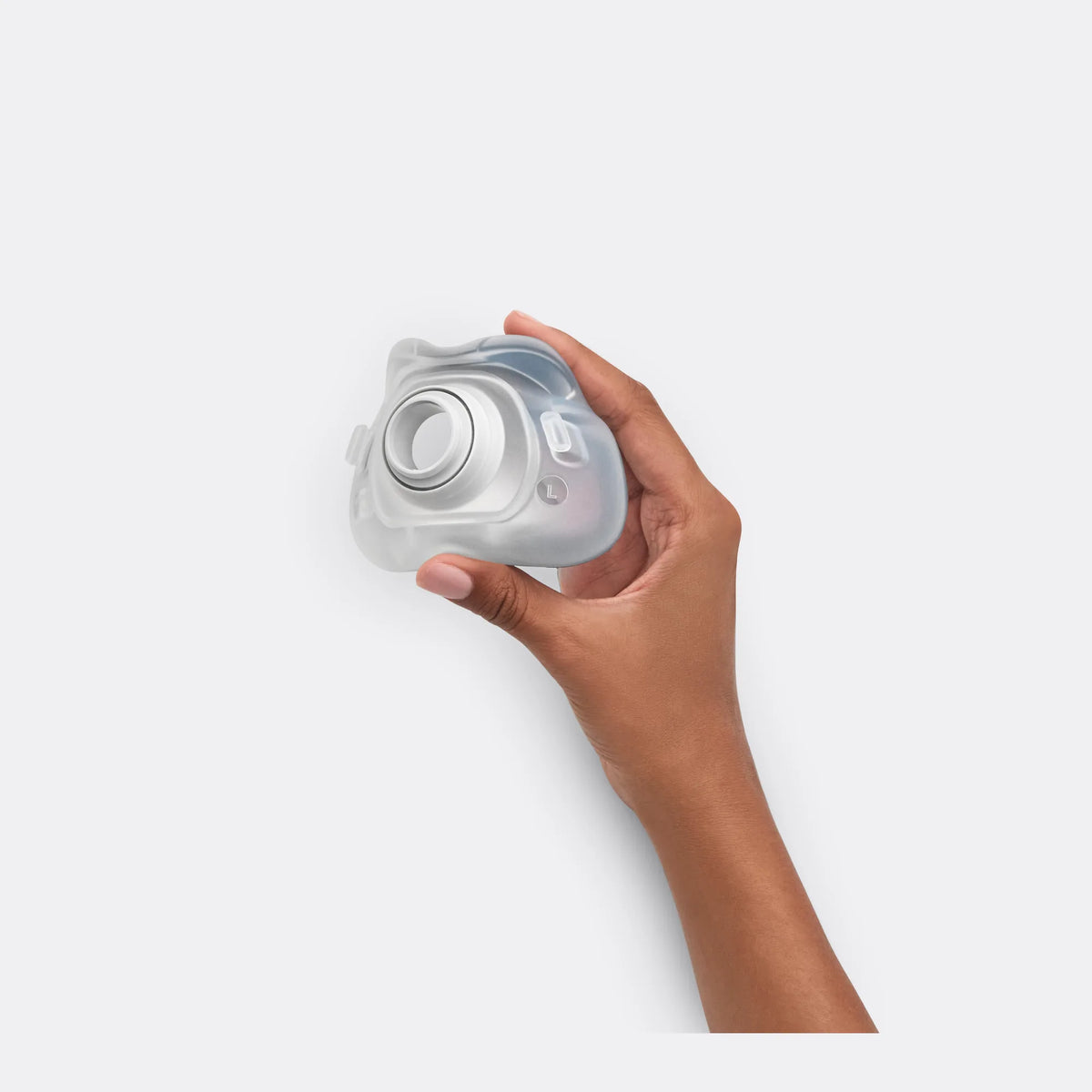 Hand holding the ResMed AirTouch F40 ComfiSoft cushion, large size