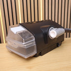 ResMed ClimateLineAir heated tube plugged into a CPAP machine beside its clear humidifier water chamber