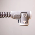 Side profile of ResMed ClimateLineAir heated tube cuff with coiled hose and release latch