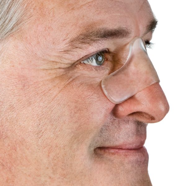 Close up side view of nasal pad on mans face