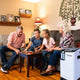 woman using the OxyHome Stationary Oxygen Concentrator while playing in family, demonstrating its quiet and efficient operation.