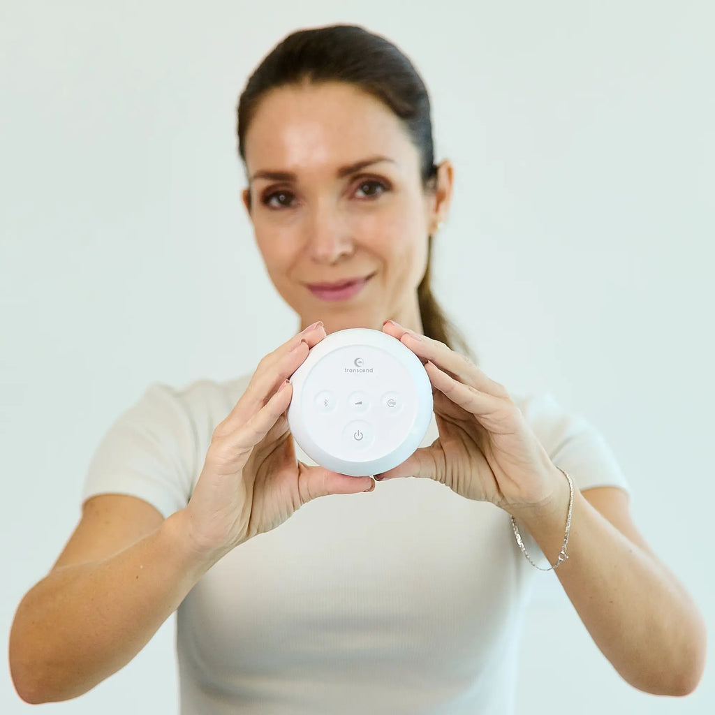 woman holding the Transcend Micro Auto Travel CPAP Machine