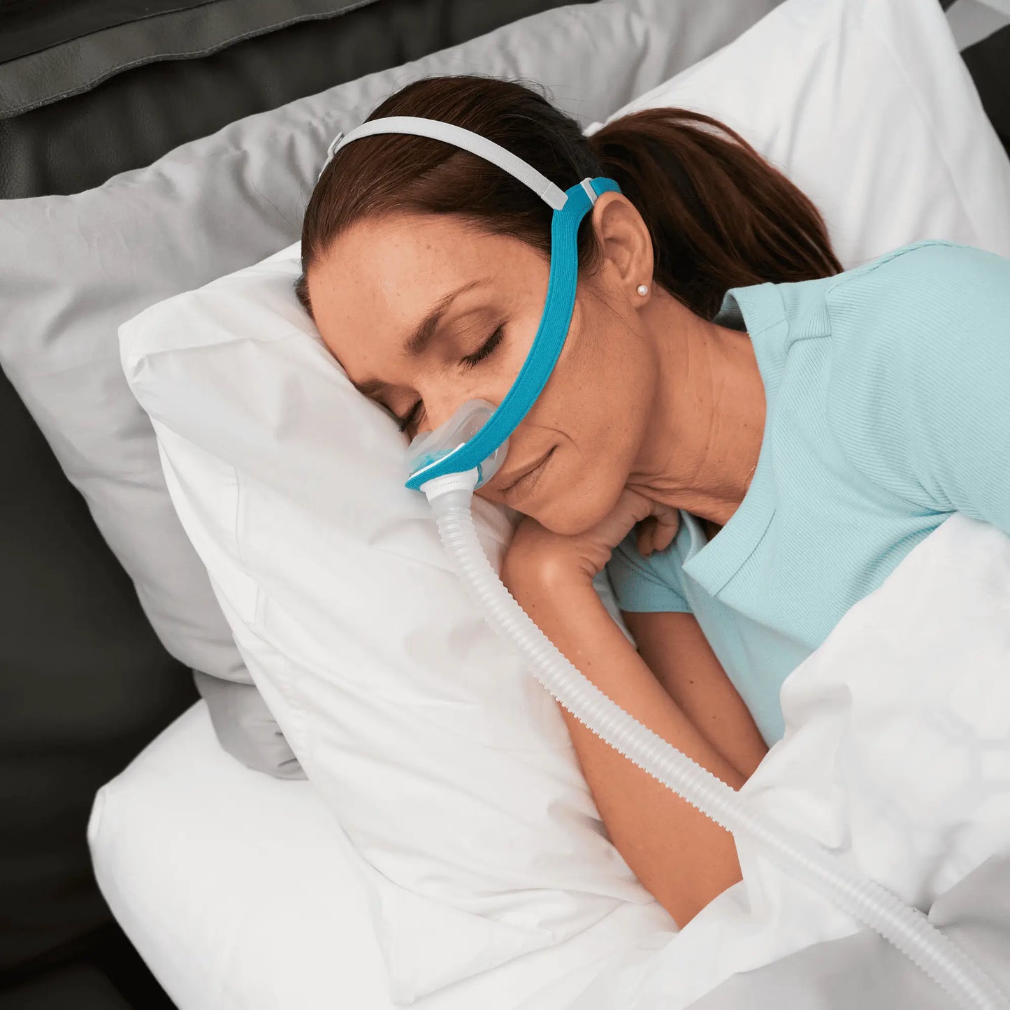 Closeup view of a woman sleeping with Evora mask.