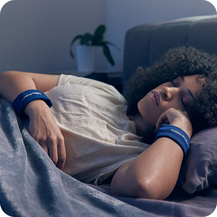 woman using the TouchPoints for Sleep Wearable Sleep device