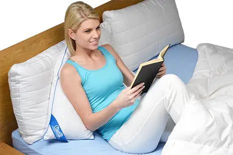 woman using the L Shaped Body Pillow Contour reading