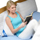 woman using the L Shaped Body Pillow Contour reading