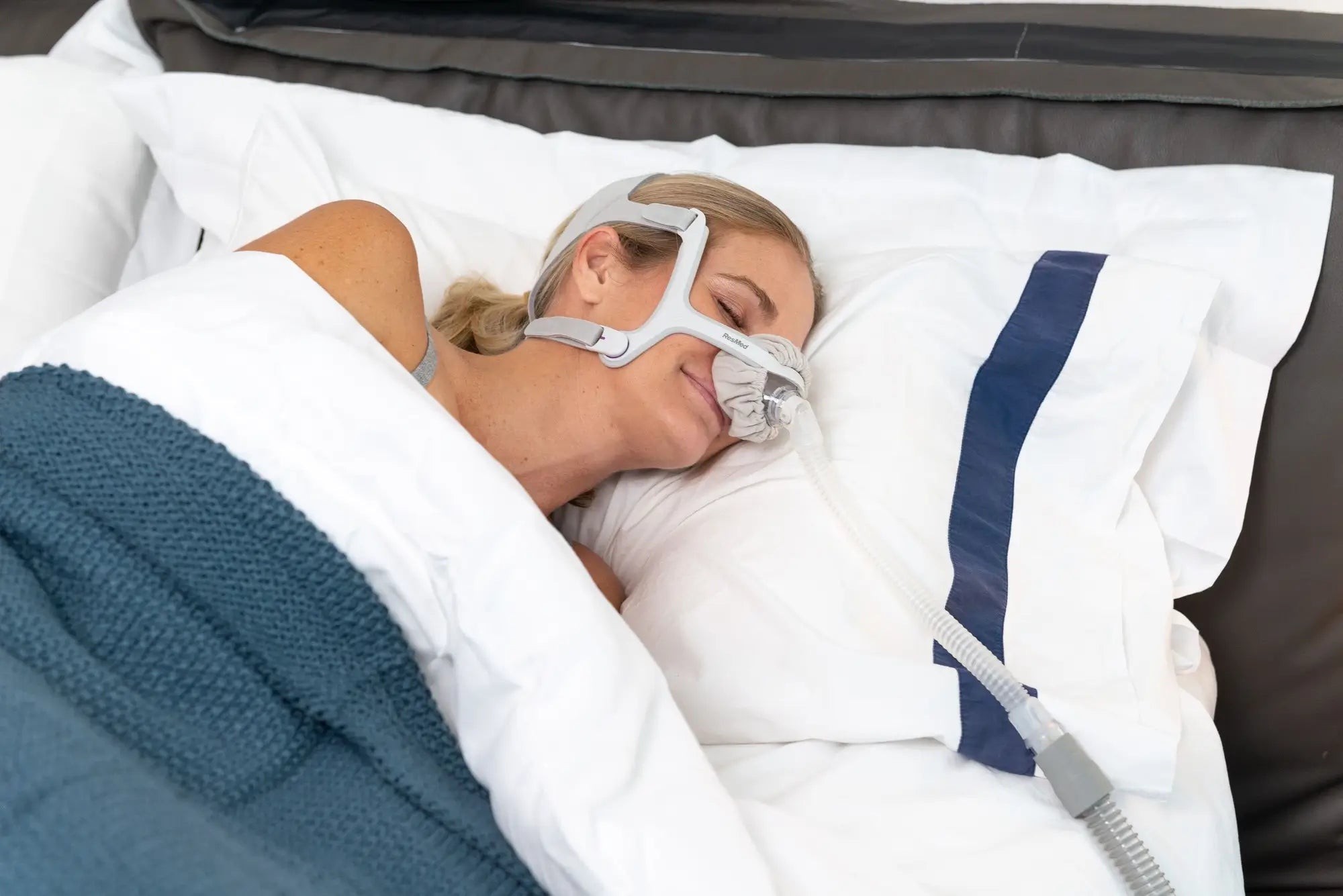 Woman sleepingusing the nasal cpap mask liner