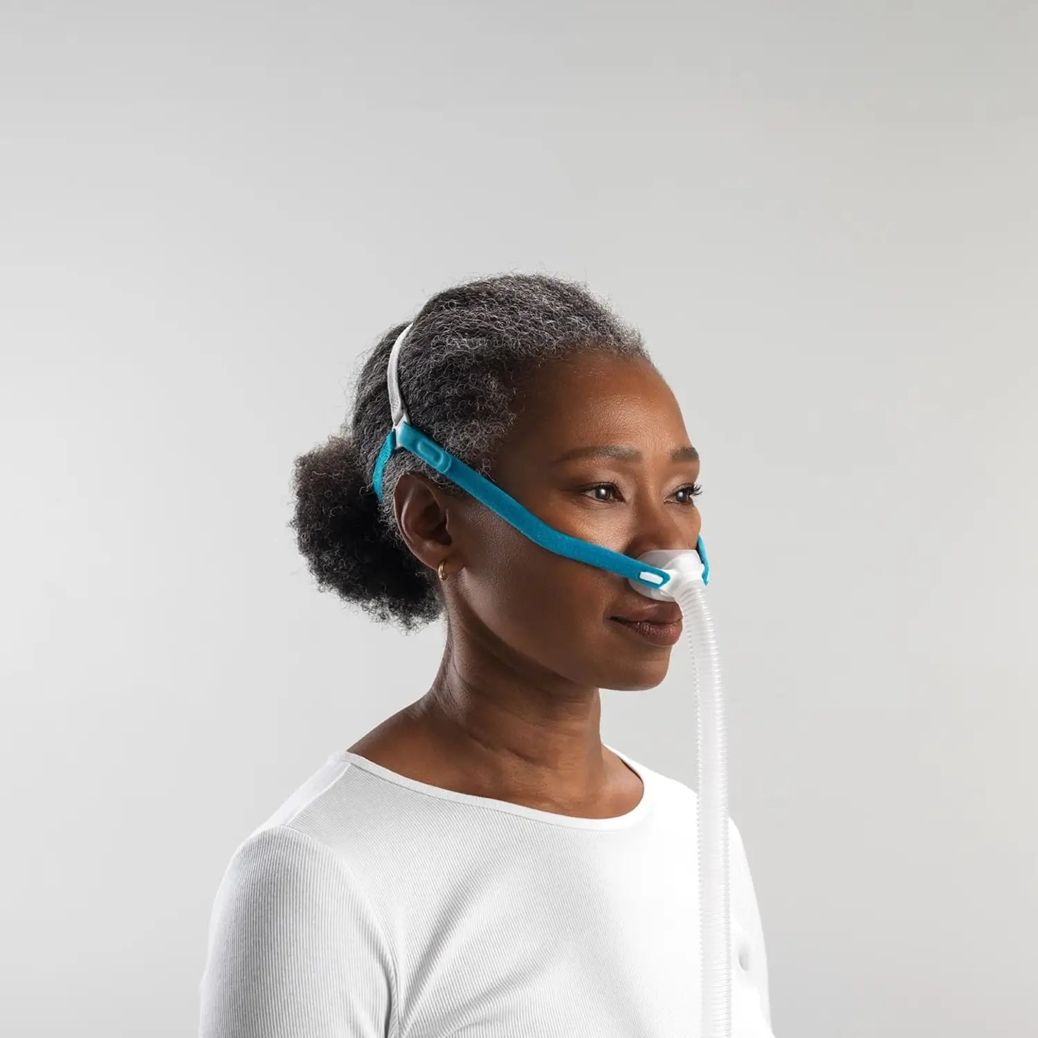 Woman using the nova micro cpap mask