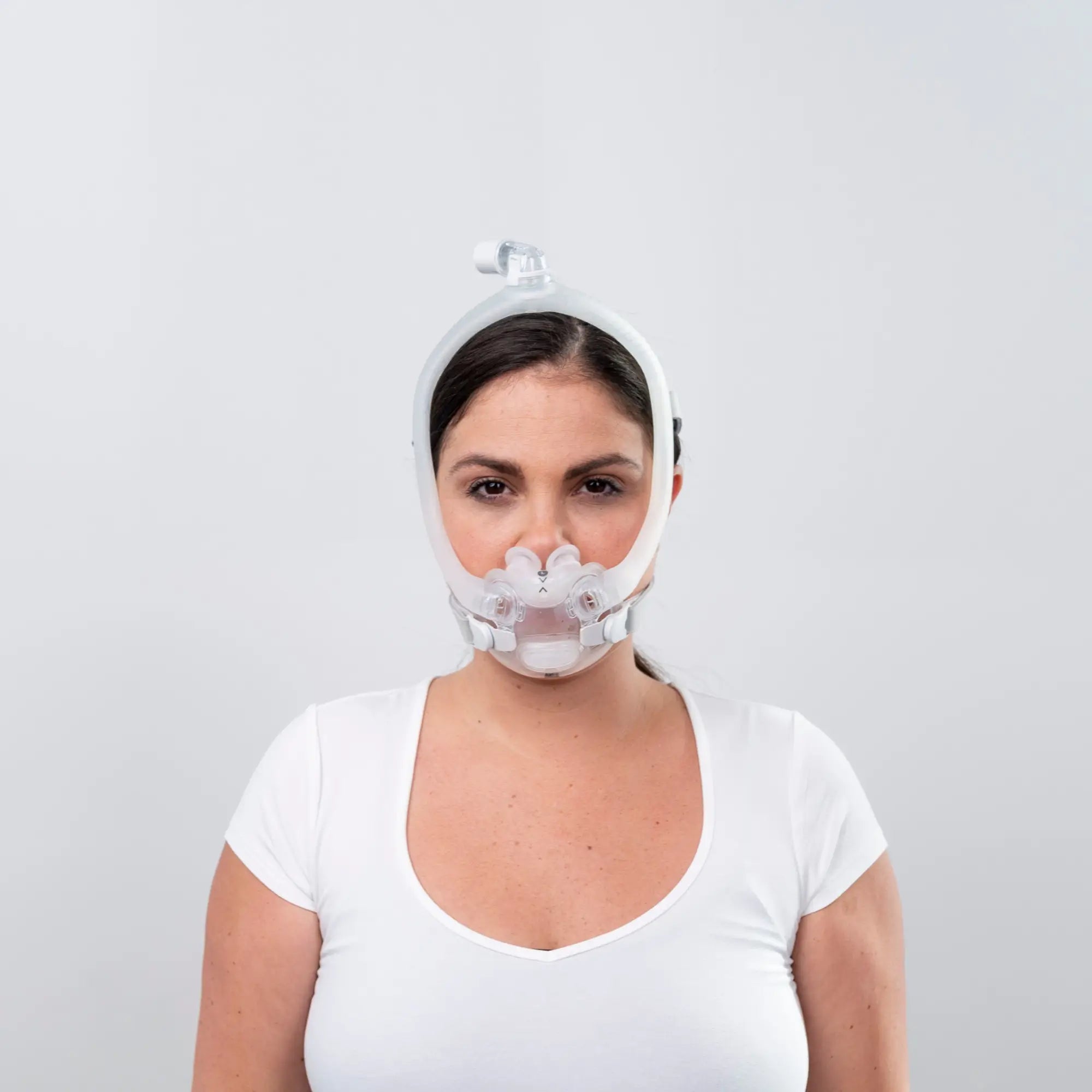 woman using the resmed airfit x30i oral nasal full face cpap mask side front