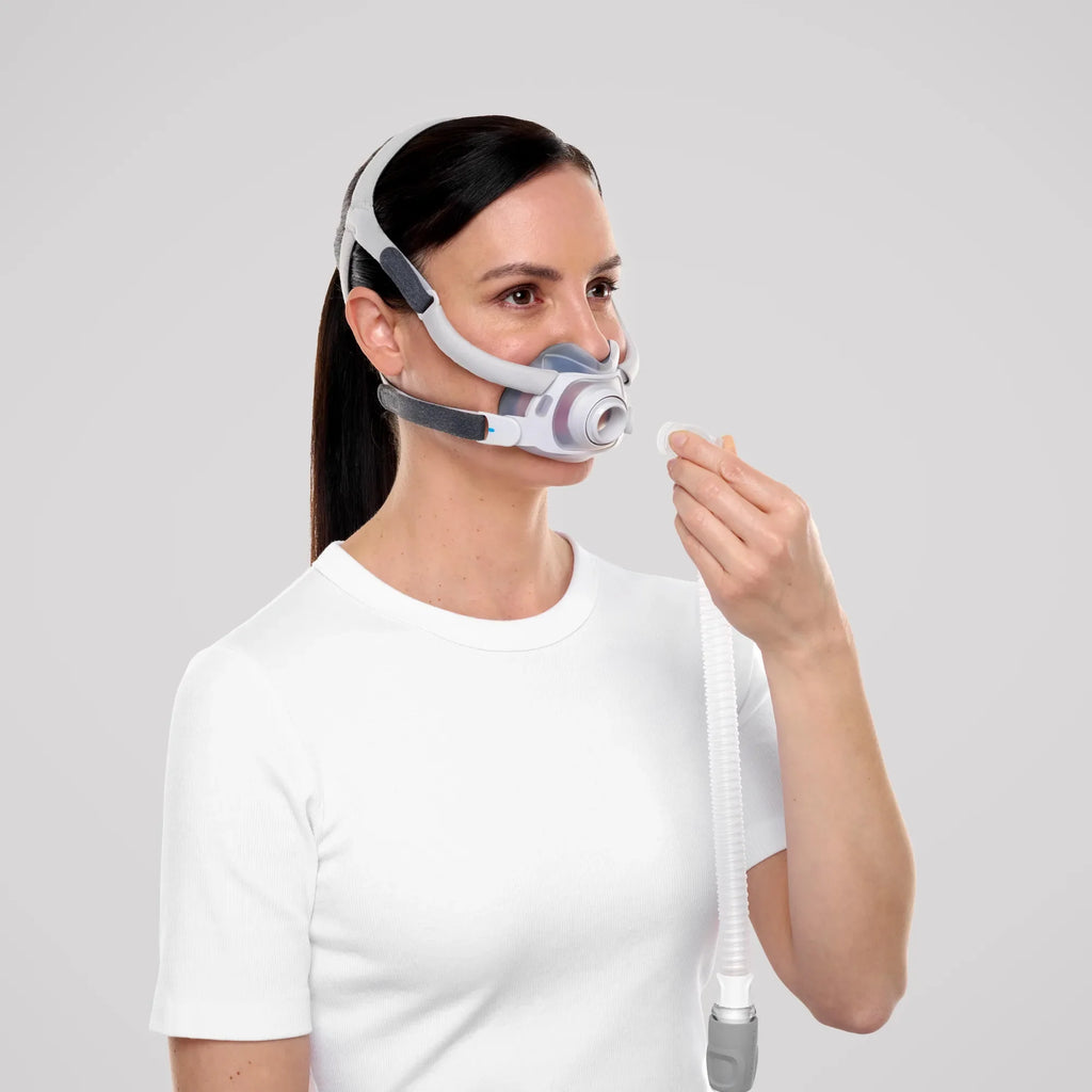 Woman wearing the ResMed AirTouch F40 full face mask, front three-quarter view