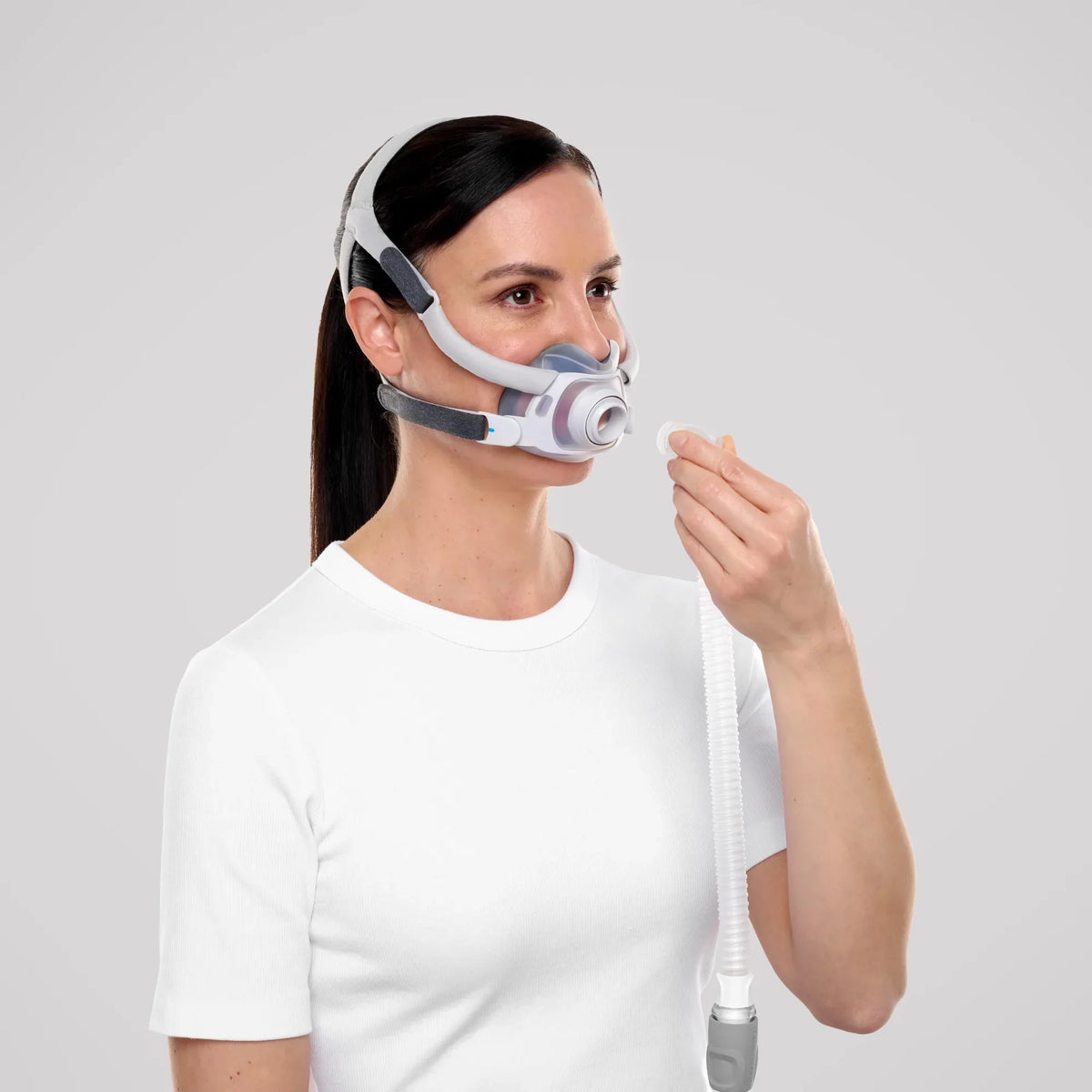 Woman wearing the ResMed AirTouch F40 full face mask, front three-quarter view