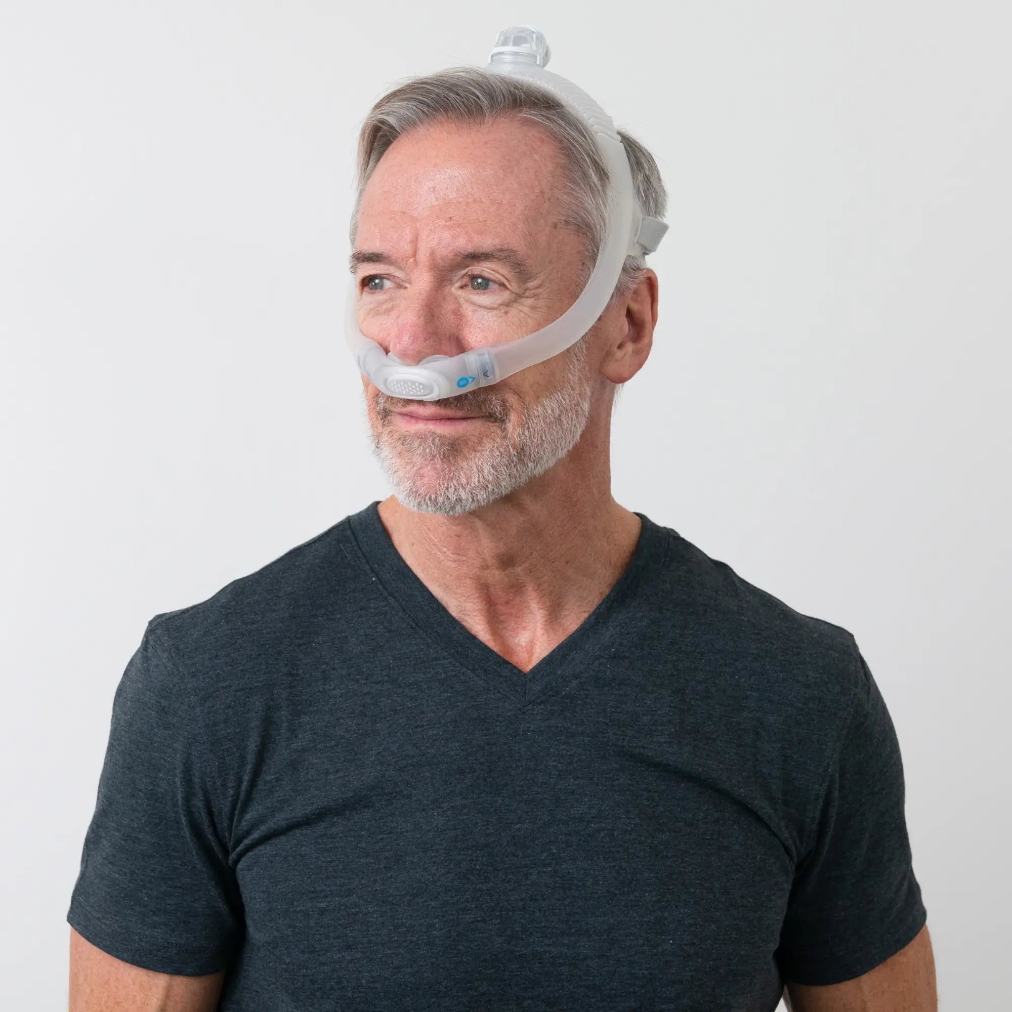 man wearing the ResMed AirFit P30i Nasal Pillow Mask side