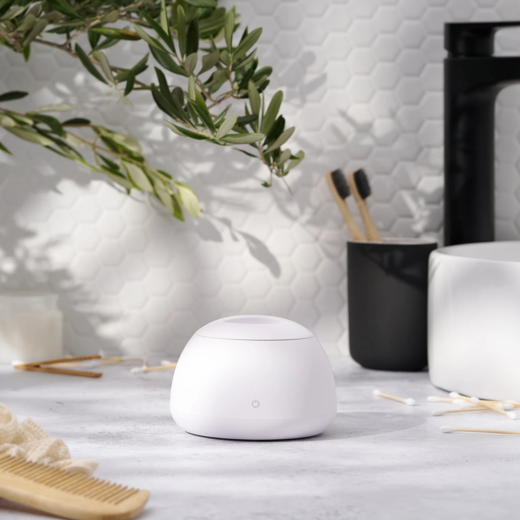 Zima Dental Pod Ultrasonic Cleaner for Retainers and Aligners in the bathroom