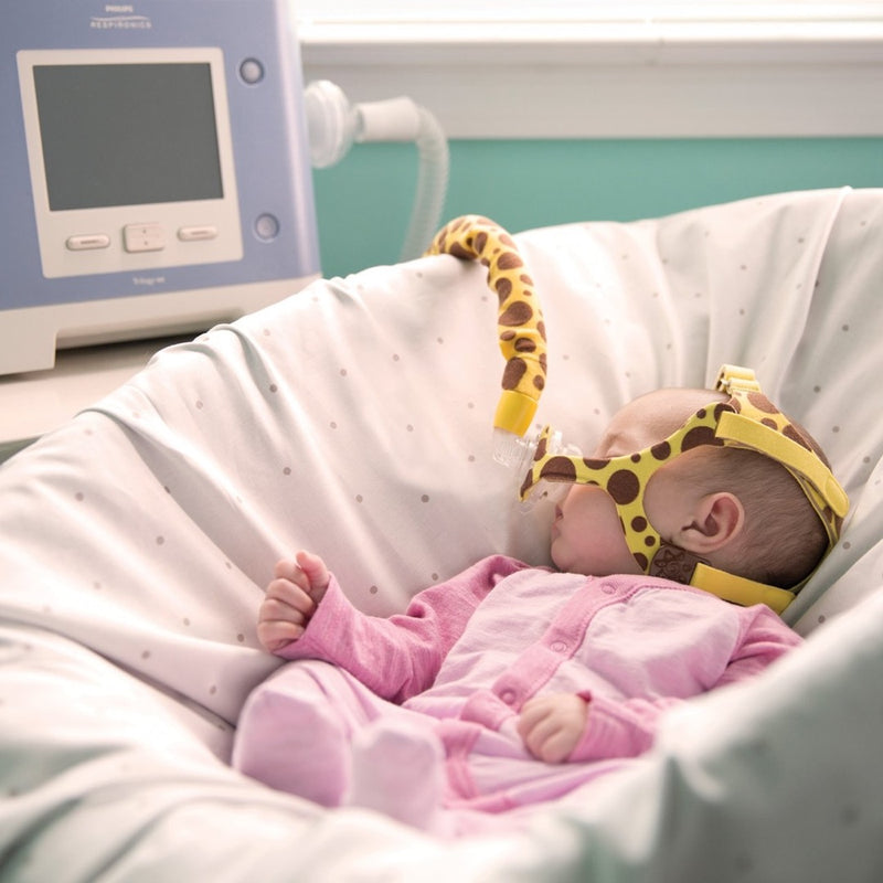 Baby sleeping with Wisp Pediatric Nasal Mask.