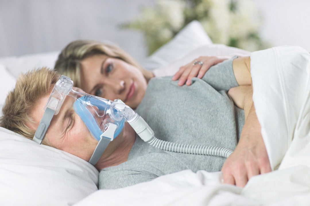 Couple sleeping with man using Amara Full Face CPAP Mask with Gel & Silicone Cushions