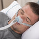 Man sleeping with Brevida Nasal Pillow CPAP Mask