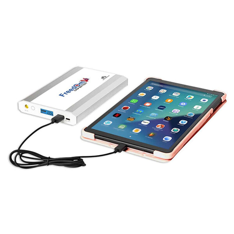 Freedom CPAP Travel Battery Connected To Tablet.