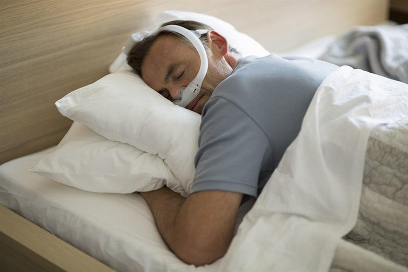 Male user sleeping with DreamWear mask