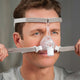 Man adjusting the straps from the grey headgear for Pico Nasal CPAP Mask Fit Pack by Phillips Respironics.