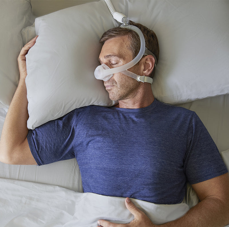 Man sleeping with DreamWisp Nasal Mask for Phillips Respironics