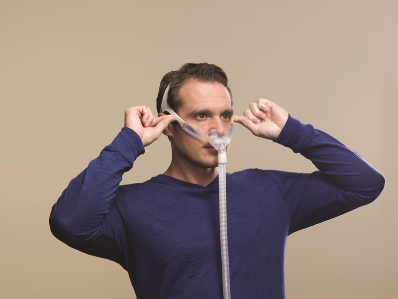 Man adjusting the Nuance CPAP Mask.