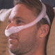 Man using the Philips Respironics DreamWear nasal mask.