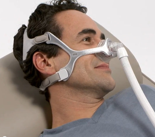 Man using the Wisp CPAP headgear