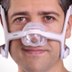 Man adjusting headgear of AirFit N20 Mask