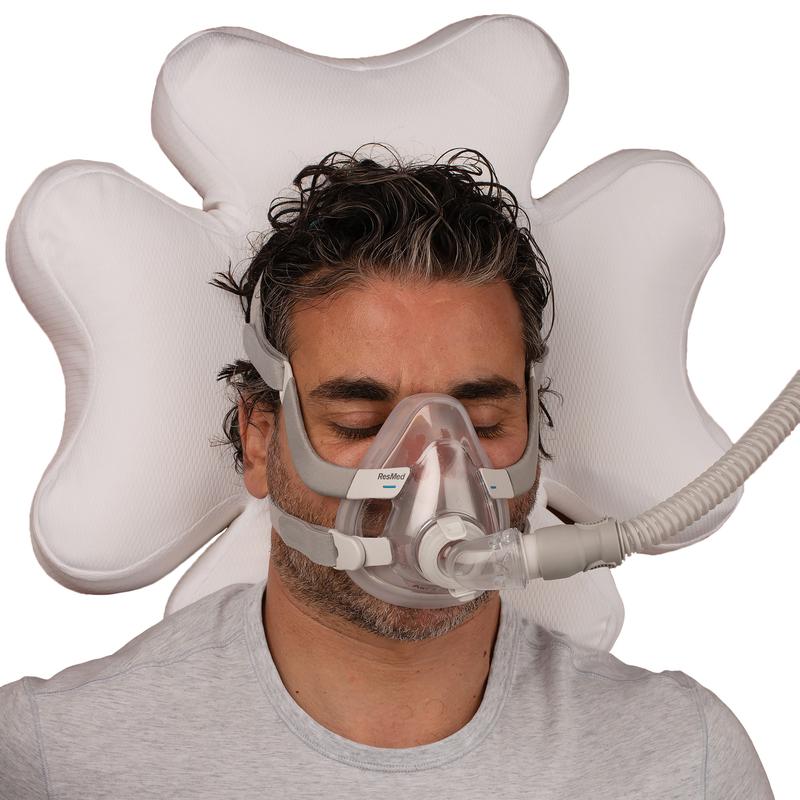 Man laying down on pillow.