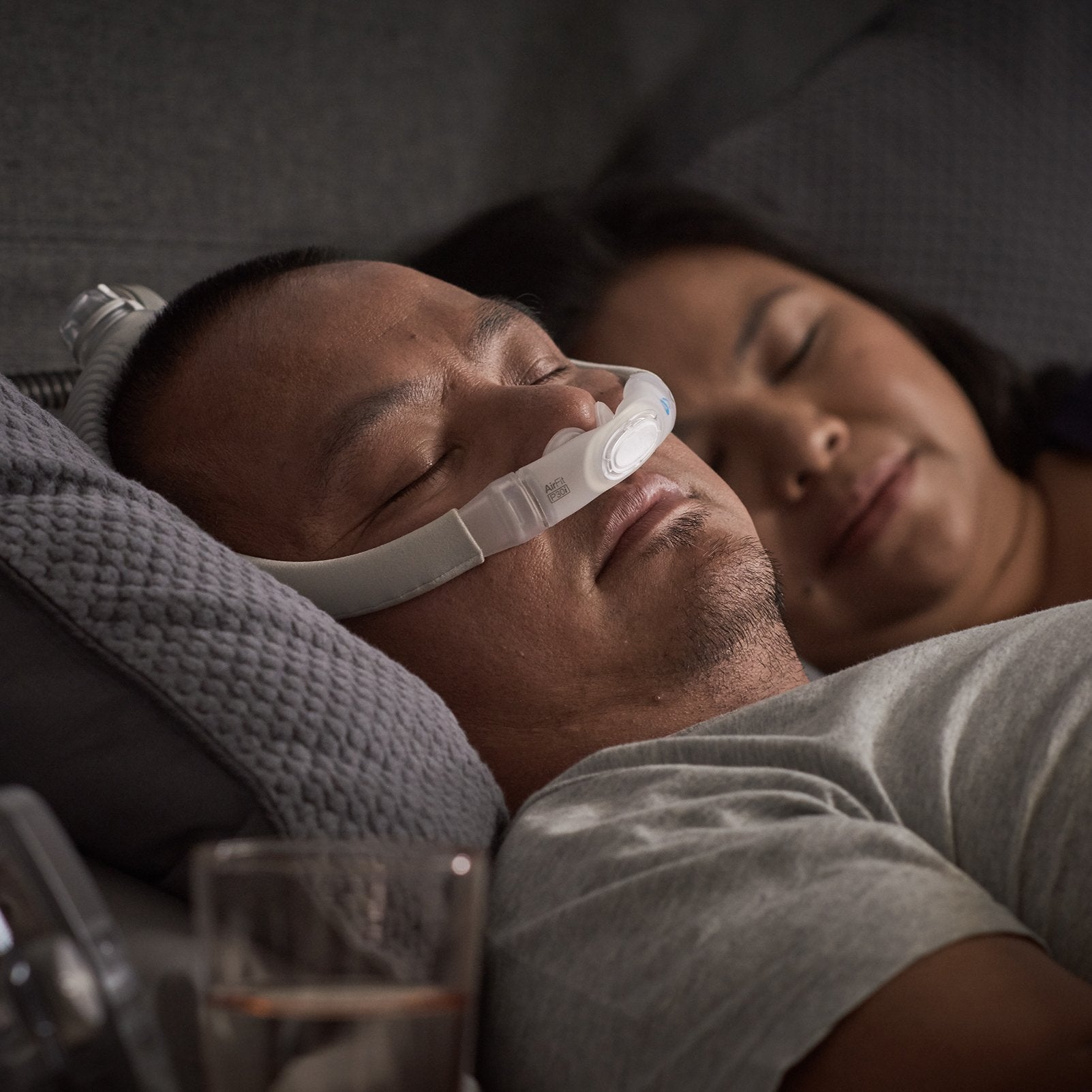 Man Sleeping with ResMed AirFit P30i Frame System.