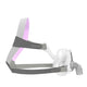 Side view of clear nasal mask with grey headgear and pink accents for AirFit F10 for Her Complete Mask by ResMed.