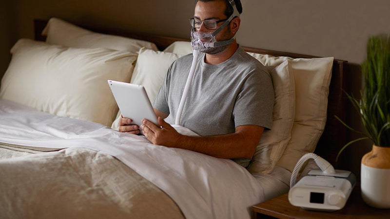 Man reading with Amara full face mask on his face
