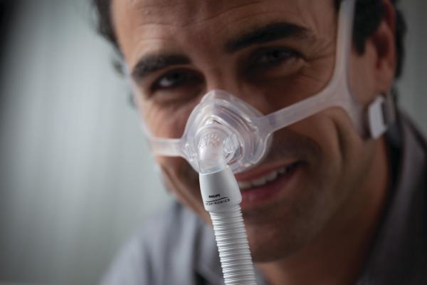 Man wearing Frame for Respironics Wisp Nasal Mask
