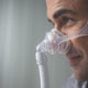Side view of man wearing Frame for Respironics Wisp Nasal Mask