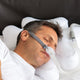 Man sleeping using Snugell Pillow.