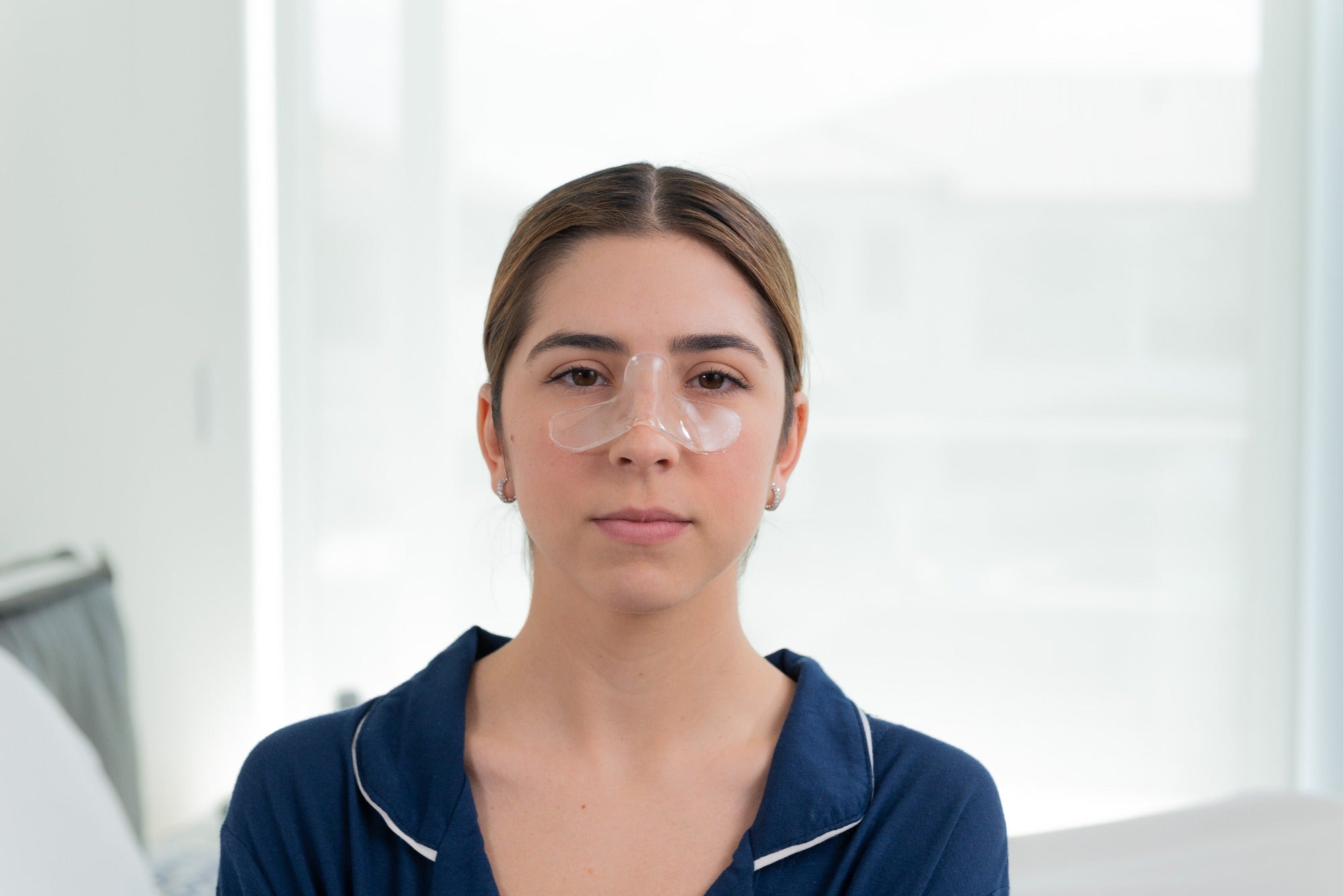 Woman wearing nose pads.