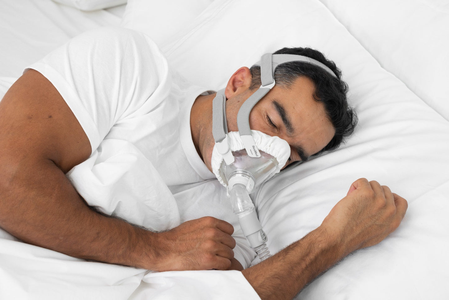 Man wearing mask liner while sleeping.