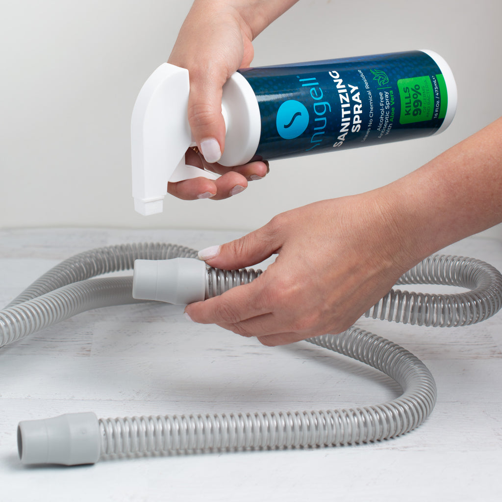 Spraying a CPAP tubing.