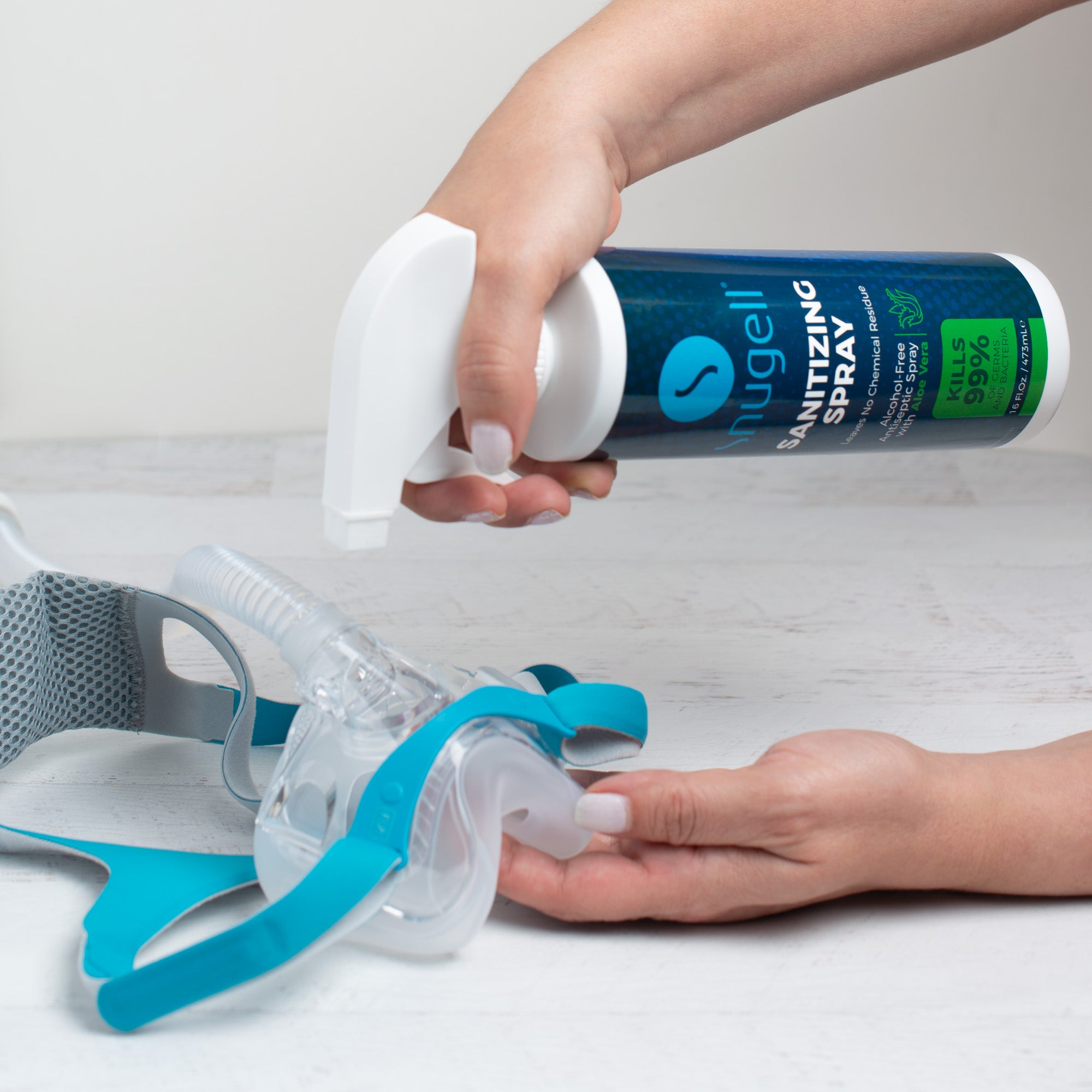 Spraying the cushion of a CPAP mask.