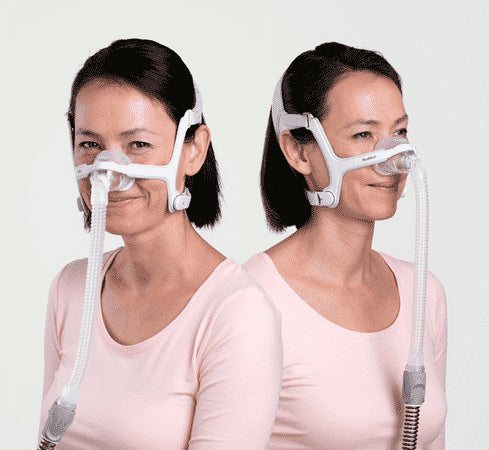 Women using ResMed Air Touch N20 Nasal Mask For Her with grey and lavender part color on headgear.
