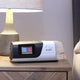 AirSense 11 on nightstand next to bed.