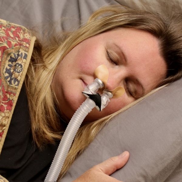Woman sleeping with Bleep Eclipse CPAP Mask.
