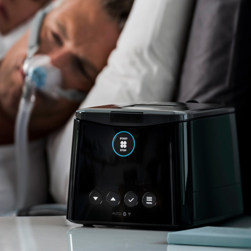 Sleepstyle CPAP machine on nightstand.