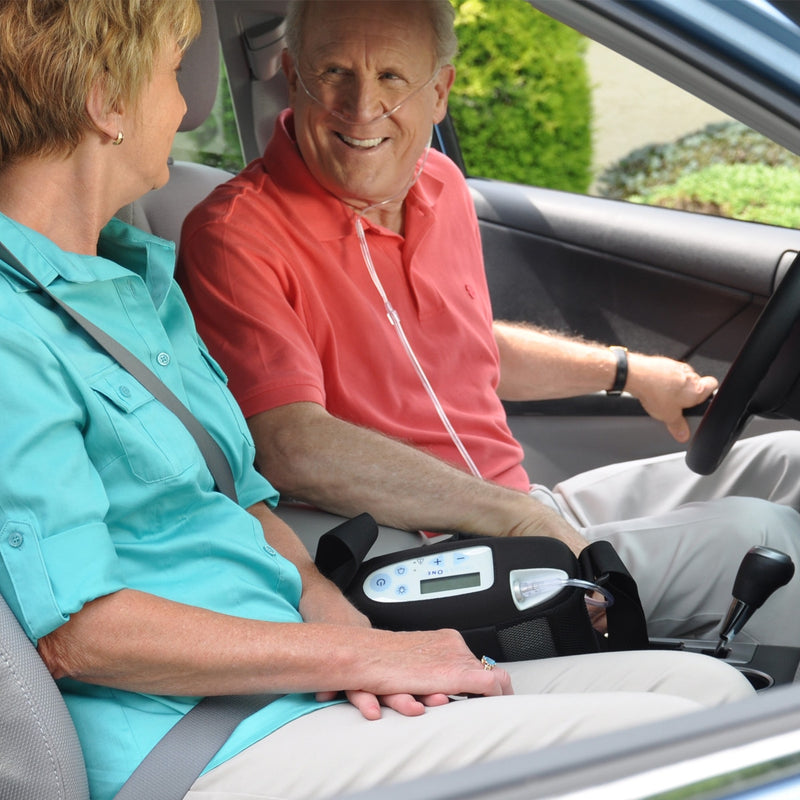 Man Driving With Inogen One G3 Portable Oxygen Concentrator.