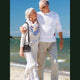 Couple On Beach Using Inogen One G5 Portable Oxygen Concentrator Bundle