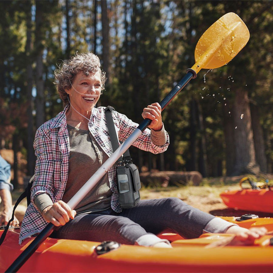 Woman White Water Rafting With Her Inogen One G5 Portable Oxygen Concentrator Bundle