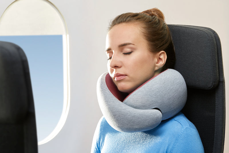 Woman Sleeping On Plane With Dreamtastic Neck Pillow.